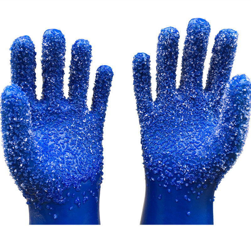 Guantes recubiertos de partículas blancas de PVC azul