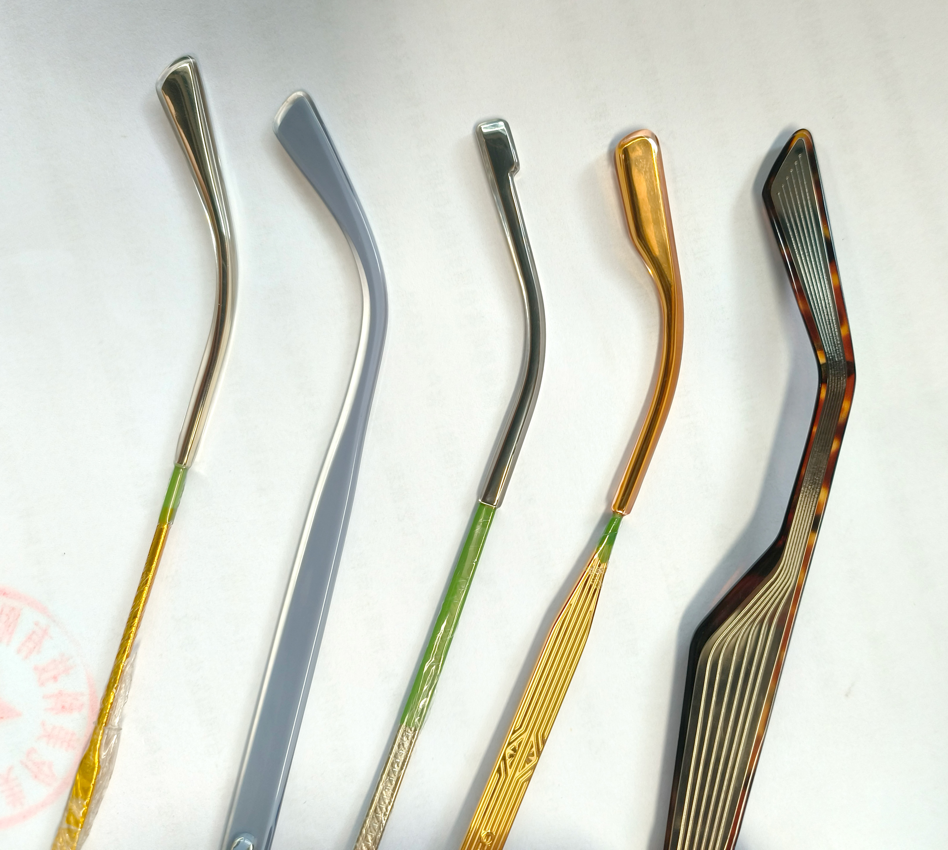 Injection Molding with Epoxy Resin Encasing Electroplated Metal Temples