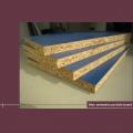 E1 cost of particle board first class