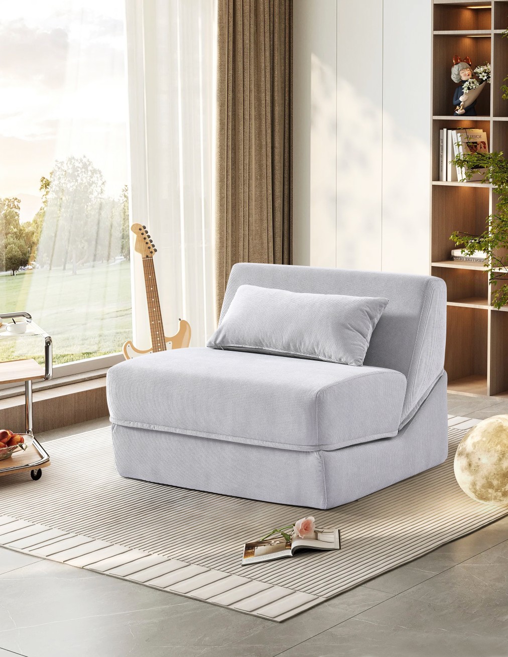 Elegante divano pieghevole grigio per piccoli spazi