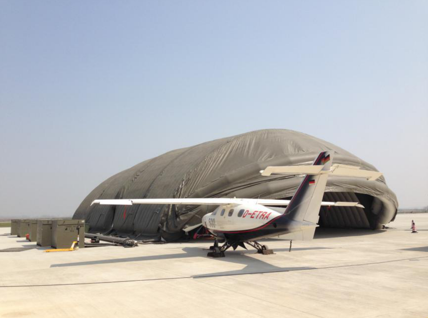 EXTRA 500 aircraft stored inside an inflatable hangar