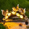 Estátuas de esquilo do jardim luz solar