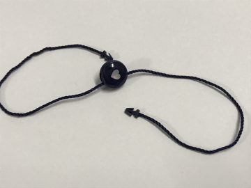 Plastic strung merchandise tags