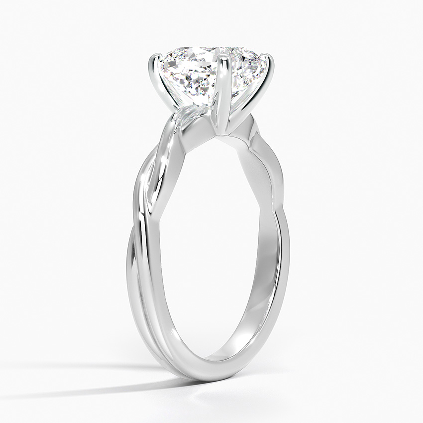 Angled na profile ng twisted shank engagement ring na nagpapakita ng four-prong secure na setting