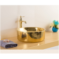 Lavabo redondo de baño mayorista de cerámica de lujo de color dorado y negro con lavabo de encimera nuevo diseño de lavabo de arte