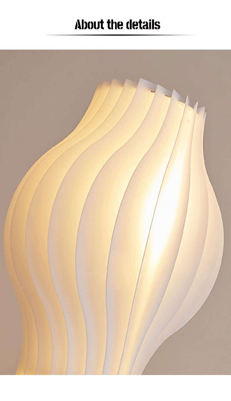  Made of white-colored strands, the grass skirt shade creates a soft and diffused light effect when the LED bulbs are illuminated.