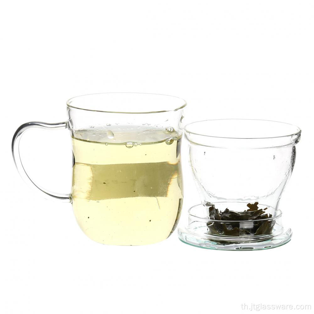 กาน้ำชาคนคนหนึ่งชุดถ้วยน้ำชาแก้วใสโบราณ