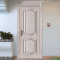 手彫りのパターンが付いた木製のドア