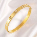 Brazalete de titanio de diamantes de imitación de ojo de esmalte