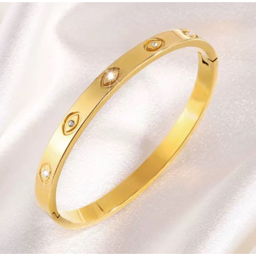 Brazalete de titanio de diamantes de imitación de ojo de esmalte