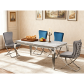Juego de comedor moderno de mármol con sillas de terciopelo