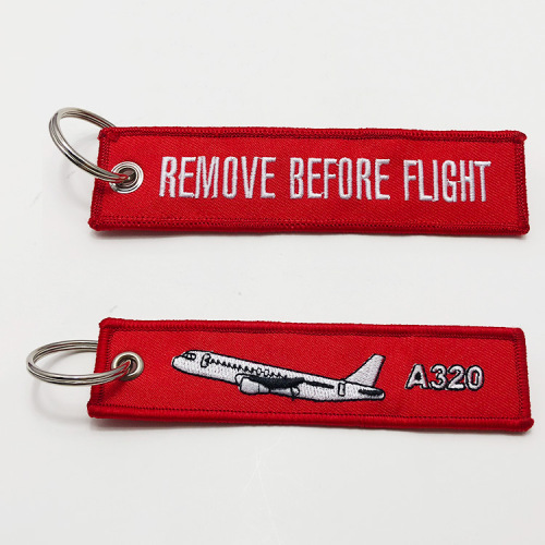 Customizable Keychain personalized remove before flight embroidered keychain Supplier