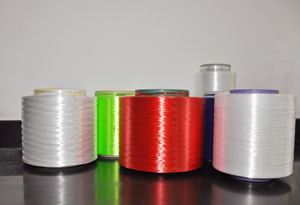 Adhesive Activated Low Shrinkage Polyester Yarn
