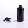 Botella de loción de vidrio negro de 100 ml con boquilla extendida