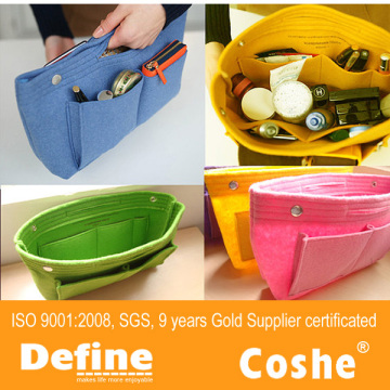 Storage bag with button closure in felt