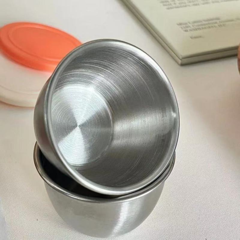 Elegant Metal Cups and Bowls with Smooth Arc Design