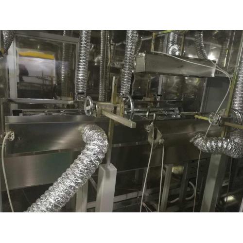 Industrial spray machine with UV curing dryer