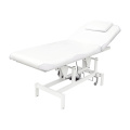 Table de massage faciale au lit