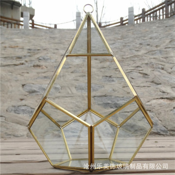 Squisito contenitore di vetro geometrico dorato