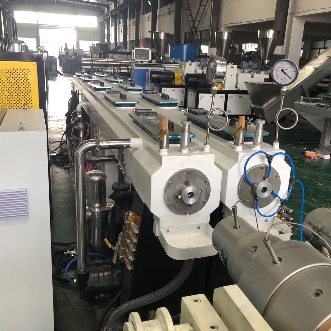 Double cavity PVC pipe extrusion line