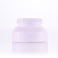 White cream jar with white plastic cap