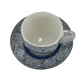 Ceramic coffee cup accompanied by a tray