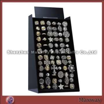 Black acrylic display with velvet covered foam pads with spaces to accommodate 72 rings