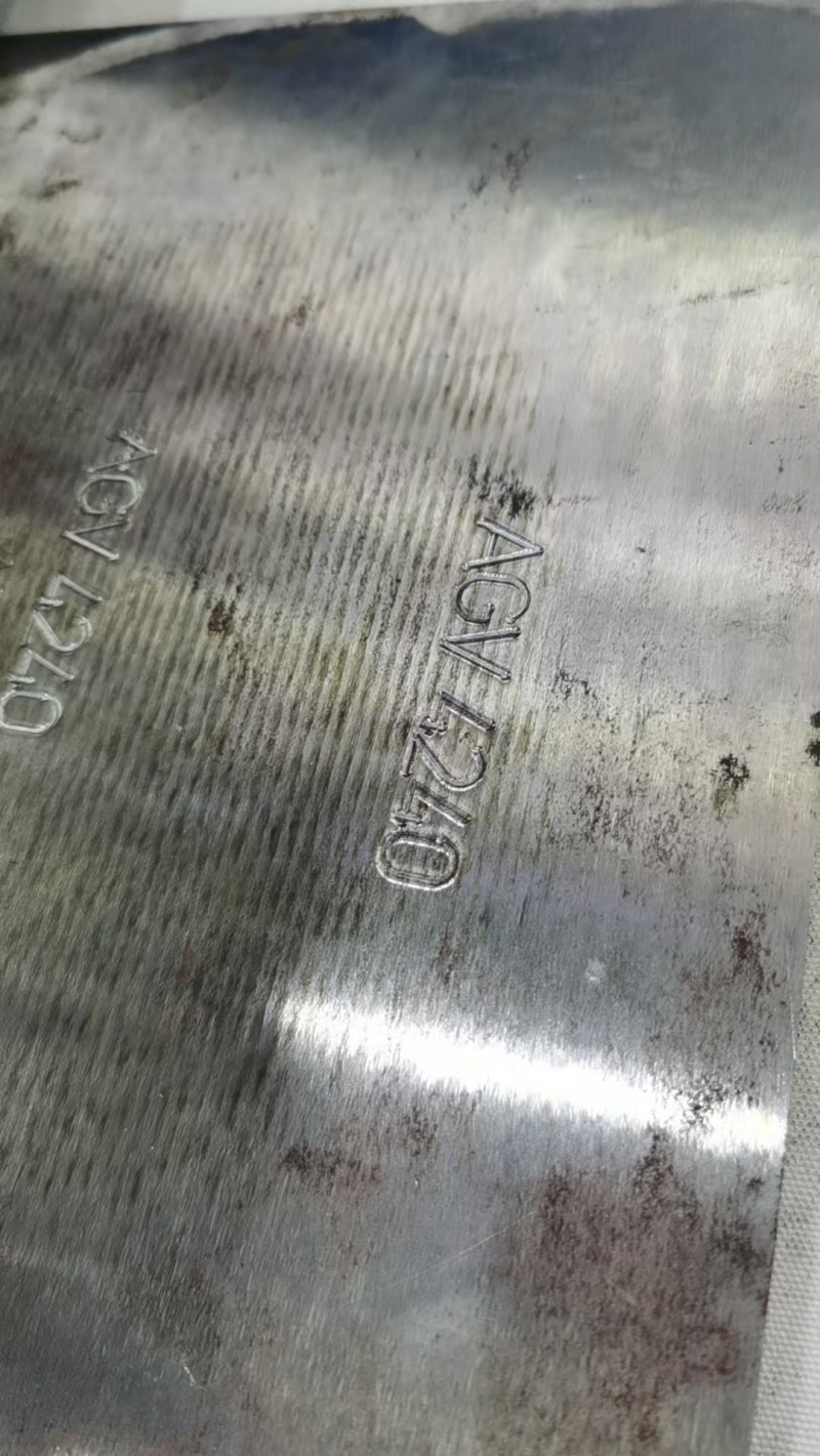 inspect the characters engraved on metal plates