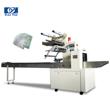Machine d'emballage d'oreiller à grande vitesse et équipement d'emballage à linge humide