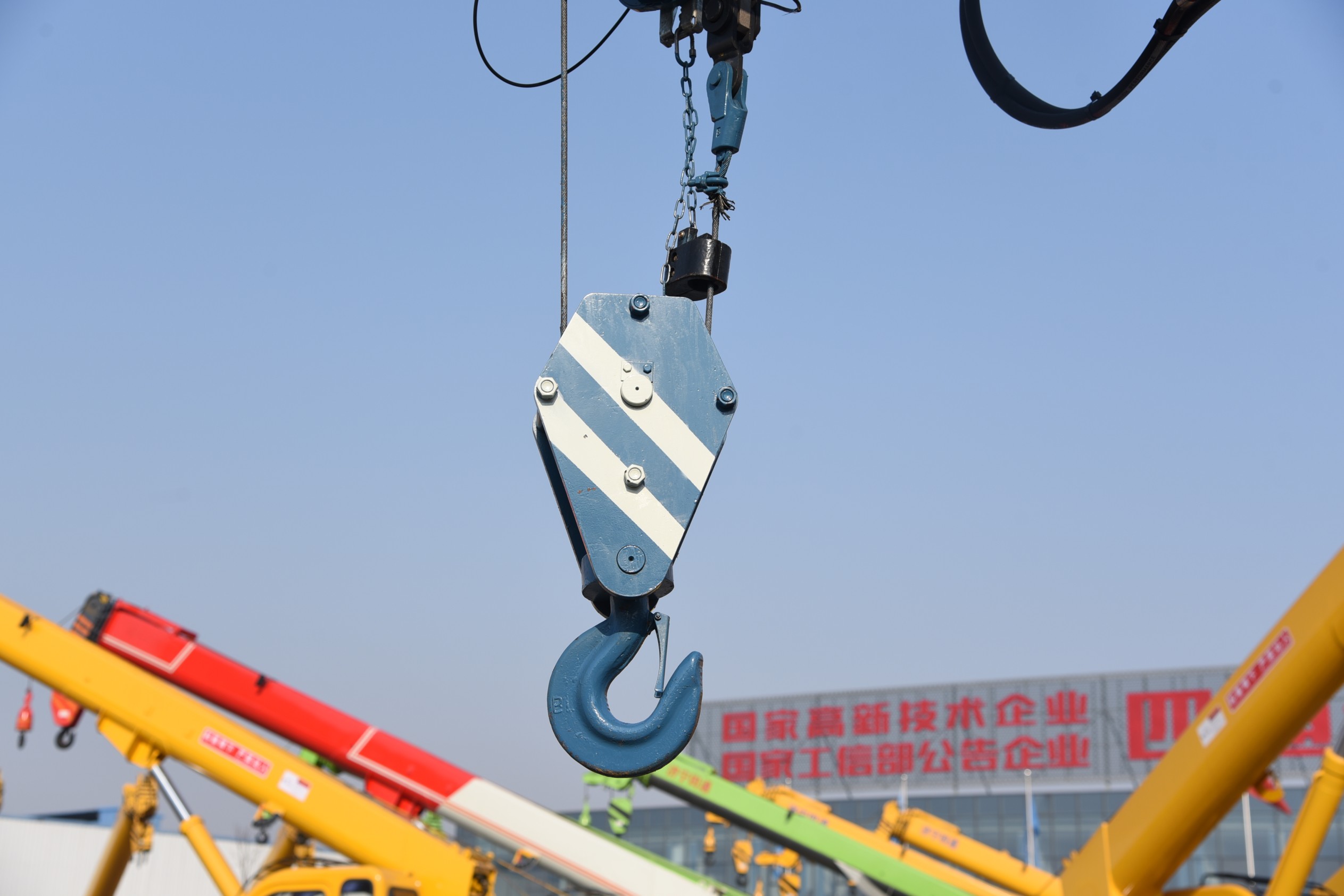 Multi-functional truck-mounted crane with drill bit