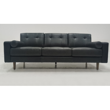 Light colored leather three person sofa