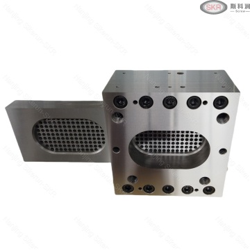 Patented twin screw extruder with hydraulic screen changer