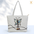 Elegante bolso de hombro de lino con mariposas coloridas para mujer