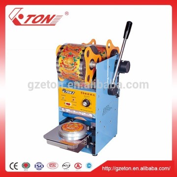 Simple vertical type small soyabean milk cup sealing machine
