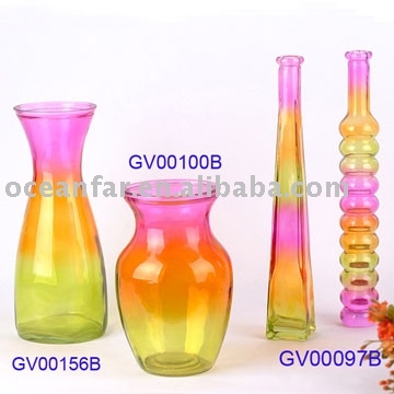 Glass vases and bottles with multicolor spray decoration.