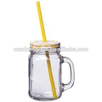 Clear glass mason jar with lid and straw.