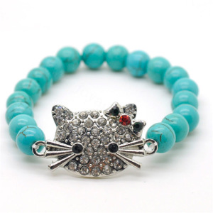 Bracelet en pierres précieuses tendues avec perles rondes turquoise de 8MM avec pièce de tête de chat en alliage Diamante