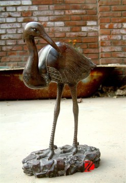 metal garden flamingo statue in bronze