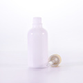 white essential oil bottle with bamboo texture dropper