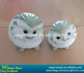 a couple of granite owl figurine