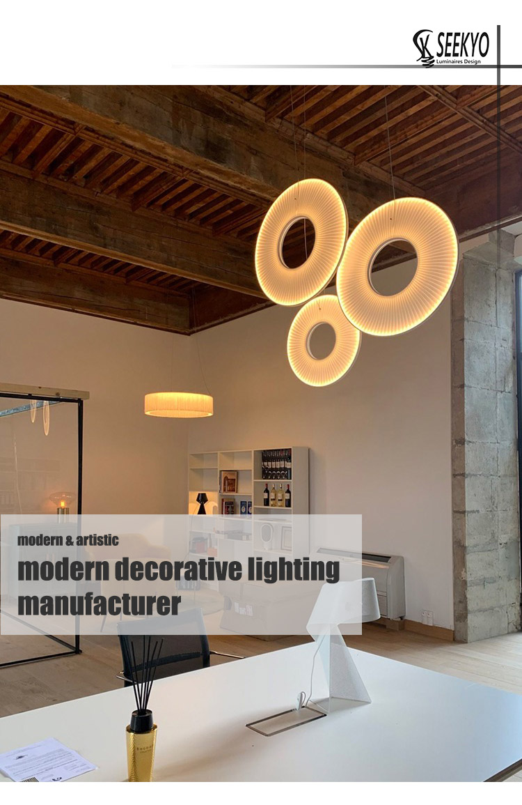 Minimalist LED modern circular fabric pendant lights can be hung vertically or horizontally to create a sleek and stylish lighting fixture. 