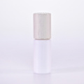 White glass roll on bottle with wooden lid