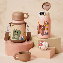 Stainless steel bottle with carrier and two lid