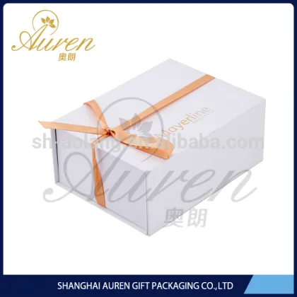 Plain white folding apparel boxes with ribbon