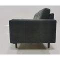 Light colored leather three person sofa