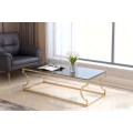 Mesa de centro de vidrio con estructura galvanizada en oro