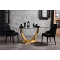 Mesa de comedor de vidrio con base de acero inoxidable dorado