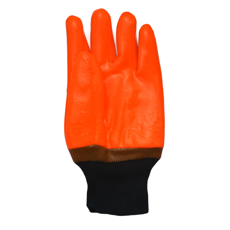 Fluoreszierende orange PVC-beschichtete Handschuhe sandig