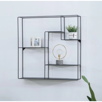 Metal wall-mounted shelf next to the TV