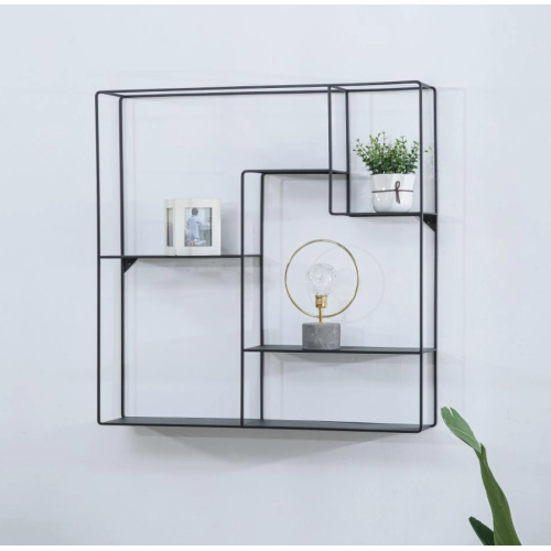 Metal wall-mounted shelf next to the TV
